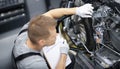 Car mechanic inspects motorcycle breakdowns in car repair shop