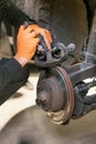 Car mechanic repair brake pads close up.