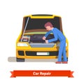 Car mechanic repairs engine at car service station Royalty Free Stock Photo