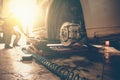 Car mechanic replace car wheels of lifted automobile by pneumatic wrench at repair service shop garage station, sunlight effect Royalty Free Stock Photo