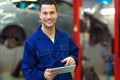 Car mechanic using a digital tablet