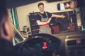 Car mechanic welcomes new client to his auto repair service. Royalty Free Stock Photo