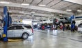 Mechanics in a car repair shop. Royalty Free Stock Photo