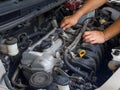 Car mechanic working in auto repair service. Royalty Free Stock Photo