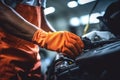 Car mechanic working in auto repair service. Mechanic checking car engine, Selective focus hands in gloves of expert technician