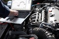 Car mechanic working in auto repair service. Royalty Free Stock Photo