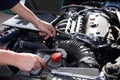 Car mechanic working in auto repair service. Royalty Free Stock Photo