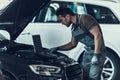 Car Mechanic Working in Auto Repair Shop Royalty Free Stock Photo