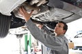 Car mechanic works in a workshop, repair of cars