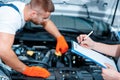 Car mechanics at the service station Royalty Free Stock Photo