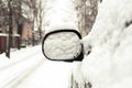 Car mirror covered of snow. Outside Royalty Free Stock Photo