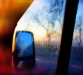 Car mirror and glass covered with water drops Royalty Free Stock Photo