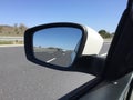 Car mirror, rear view mirror with highway Royalty Free Stock Photo