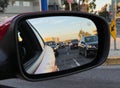 Car Mirror reflecting traffic road Royalty Free Stock Photo