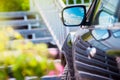 Car mirror. Reflection of sunny blue sky at the car side mirrow. Royalty Free Stock Photo