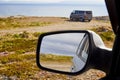 Car Mirror and reflection of tundra and sky in it Royalty Free Stock Photo