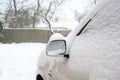 Car mirror snow capped. Outside horizontal winter-time image Royalty Free Stock Photo