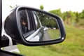 Car mirror vehicle in country road view back Royalty Free Stock Photo