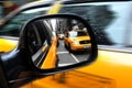 Car mirror view reflection of New York yellow taxi cabs in Manhattan New York City