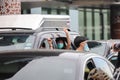 `Car Mob` Protesters a three finger salute to show symbolic gestures between driving vehicles and honk.
