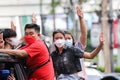 `Car Mob` Protesters a three finger salute to show symbolic gestures between driving vehicles and honk.