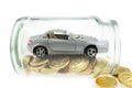 Car model on golden coins in a jar Royalty Free Stock Photo