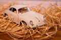 White collectible retro car model Porsche