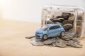 Car with money coin on wood table. insurance concept Royalty Free Stock Photo