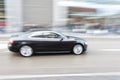 Car in motion blur, car driving fast in city Royalty Free Stock Photo