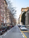 Car and motorbike parking on street in Bergamo Royalty Free Stock Photo