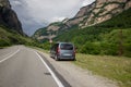 Car among the mountains, by the side of the road