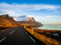 Car moves on the road among the mountains, Iceland Royalty Free Stock Photo