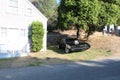Car from the movie Fast and Furious, parked next to the house, scenery.
