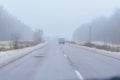 A car moving ahead on the road in winter Royalty Free Stock Photo