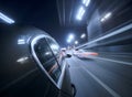 The car is moving at high speed on the night city road. Royalty Free Stock Photo