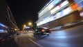 The car is moving at high speed on the night city road. Royalty Free Stock Photo