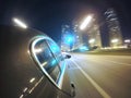 The car is moving at high speed on the night city road. Royalty Free Stock Photo