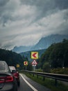 Car moving on a serpentine roadway between the mountains Royalty Free Stock Photo