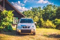 Car near wooden house Royalty Free Stock Photo