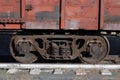 Wagon of an old rusty freight train stands on the rails