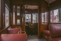 In the car of an old tram. Seats for passengers and control cabin Royalty Free Stock Photo