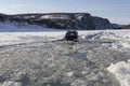 The car overcomes a water barrier of ice.