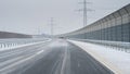 Car overtaking another car on a icy road (German Autobahn). Royalty Free Stock Photo