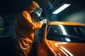Car Painter in Action, Creating a Flawless Paint Job in a Professional Workshop. created with Generative AI