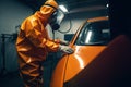 Car Painter in Action, Creating a Flawless Paint Job in a Professional Workshop. created with Generative AI