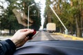 Car park automatic entry system. Man with remote control opens b