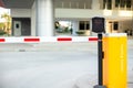 Car park automatic entry system. Security system for building access - barrier gate stop with toll booth, traffic cones