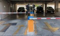 Car park automatic entry system.Security system for building access - barrier gate stop with toll booth, traffic cones