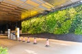 Car park entrance with wall decorated with herbaceous plants in Hong Kong