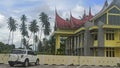 car park in front of unique roof building